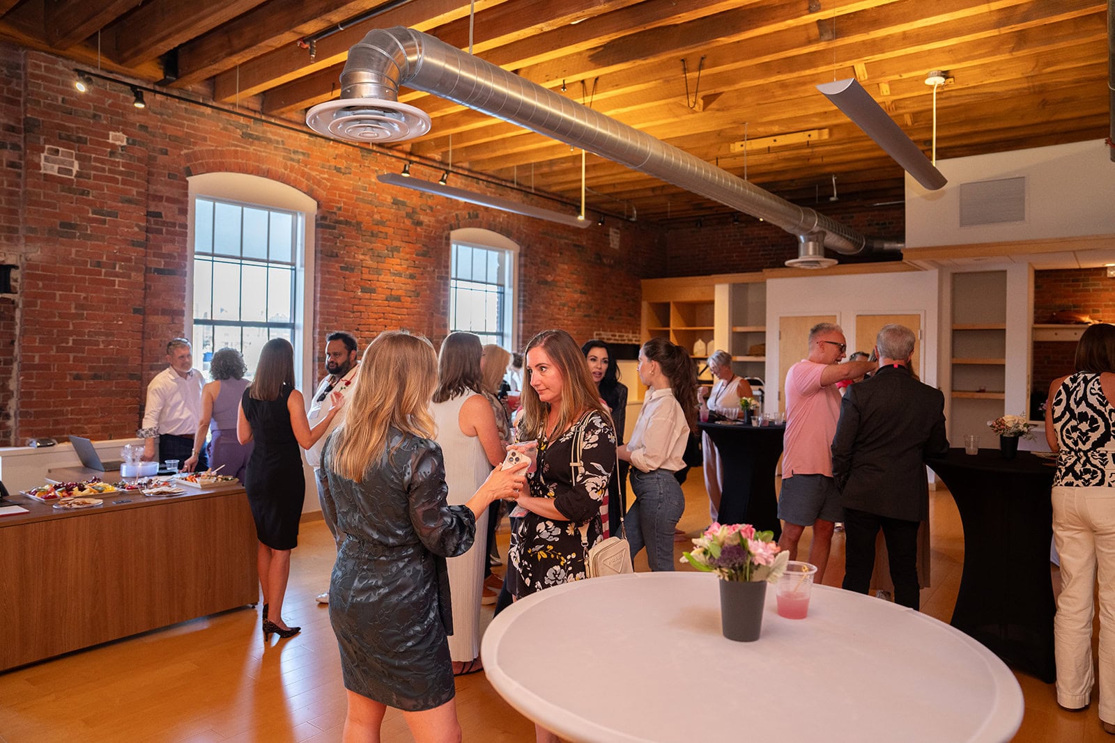 Attendees talking at an evening reception during a Superhuman Selling live event