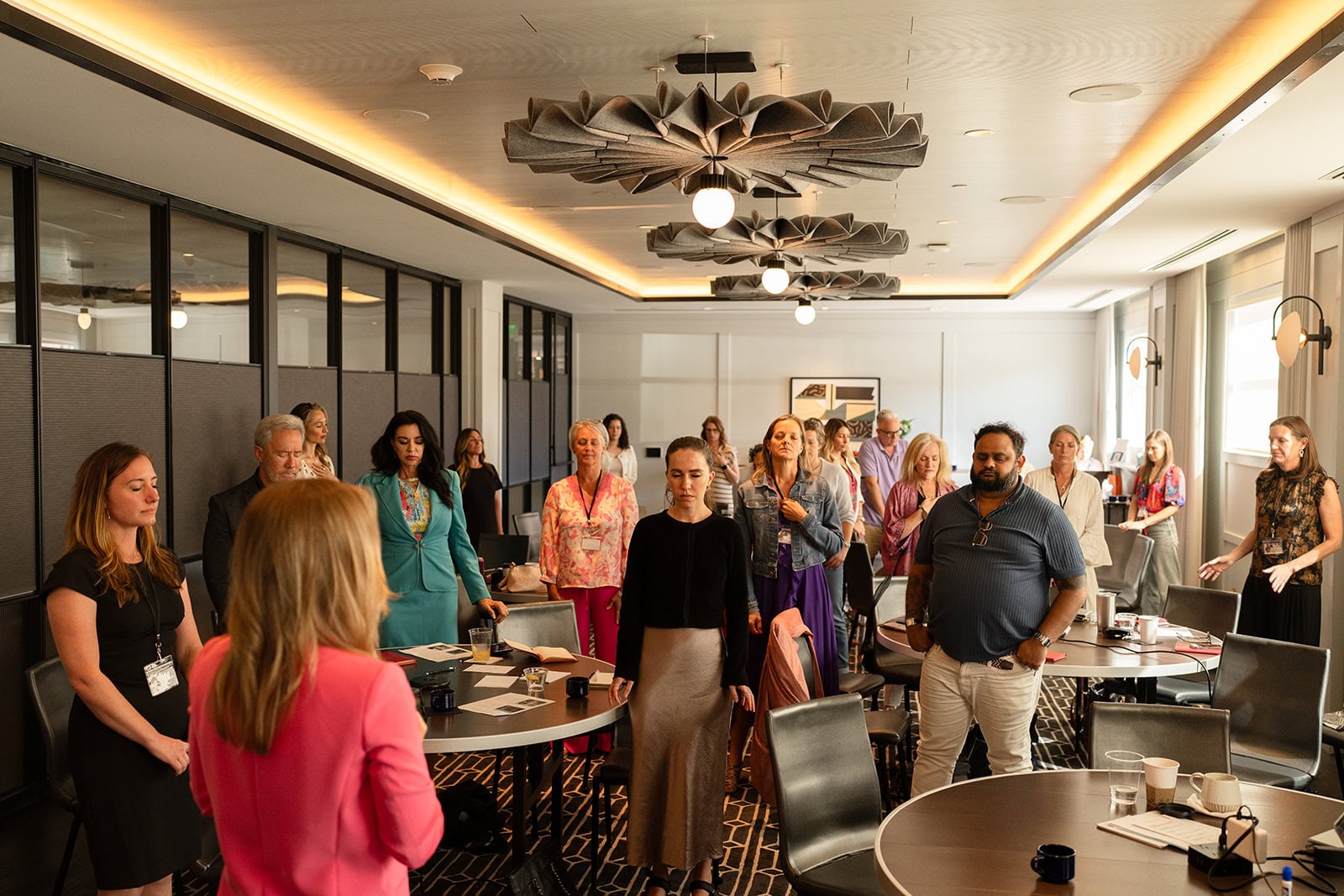 Attendees standing together during a practice at a Superhuman Selling live event